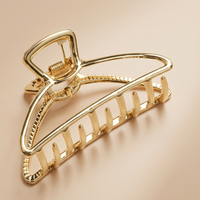 Pinza Geométrica Dorada – Accesorio Elegante para el Cabello